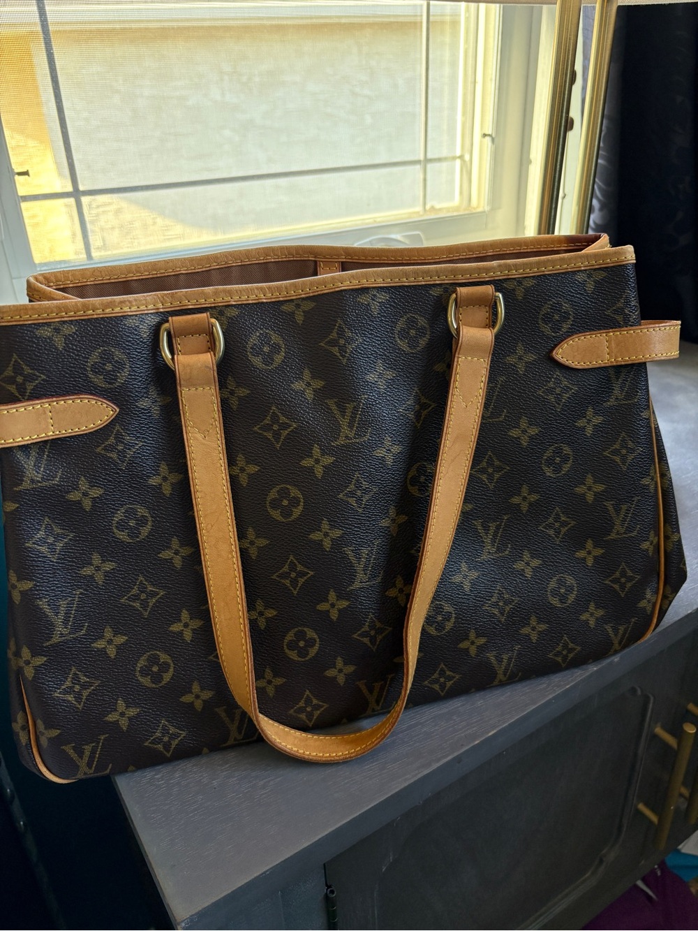 Louis Vuitton Batignolles Tote in Dark Brown with leather trim. COA